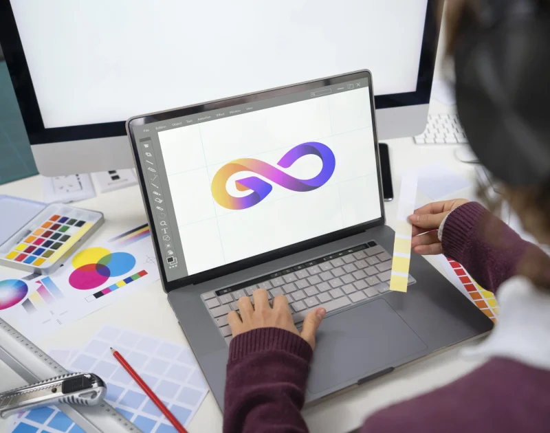 young-female-designer-working-her-laptop-min